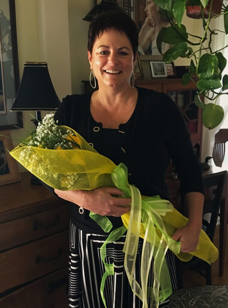 TDK Florals founder, Theresa King, holding a bouquet of flowers.
